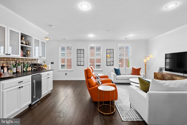 110 Commodore Ct, Philadelphia, PA 19146 - living room with bar, plenty of natural light, dark wood finished floors, ornamental molding, and recessed lighting
