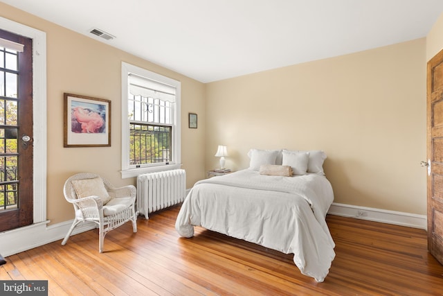 3650 Park Pl NW, Washington, DC 20010 - bedroom featuring radiator and hardwood / wood-style flooring