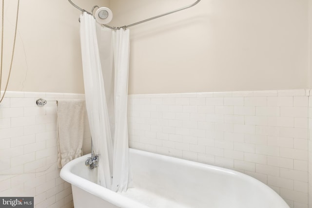 3650 Park Pl NW, Washington, DC 20010 - full bathroom with a soaking tub, tile walls, and a shower with shower curtain