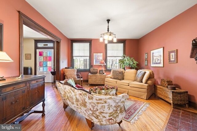 3650 Park Pl NW, Washington, DC 20010 - living area with dark wood-style floors, a chandelier, and radiator