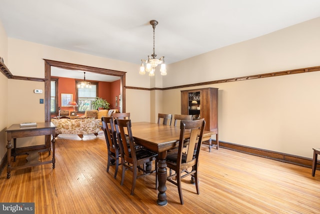 3650 Park Pl NW, Washington, DC 20010 - dining room with a chandelier and light wood-style flooring