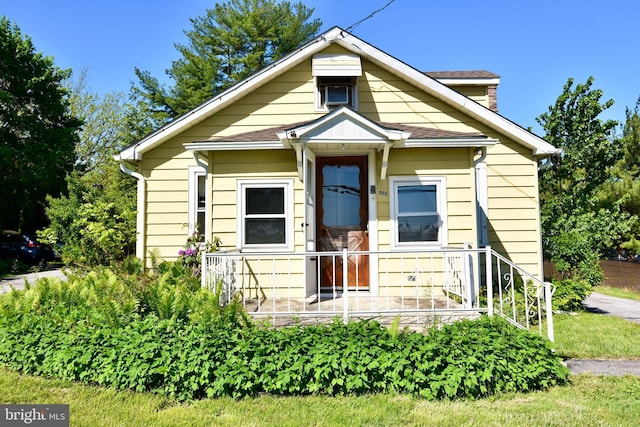 view of front of home with roof with shingles