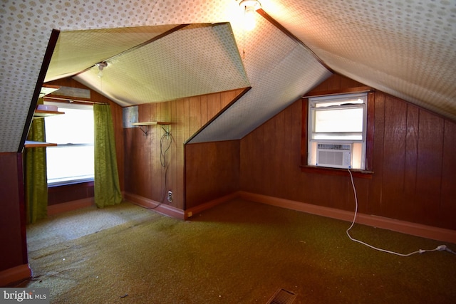 additional living space with lofted ceiling, carpet flooring, and cooling unit