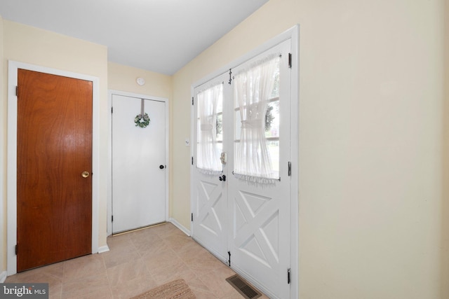 foyer entrance with baseboards