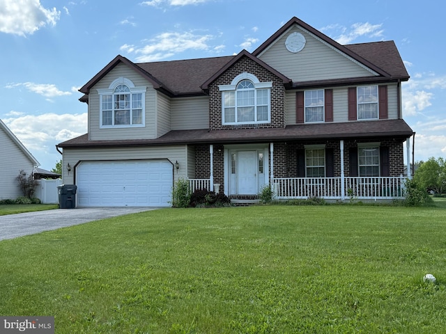 view of front of home with an attached garage, asphalt driveway, covered porch, and a front lawn