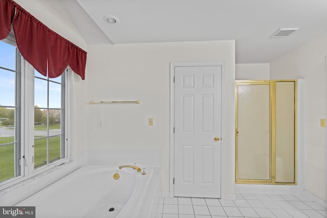 1004 Hostetter Rd, Hanover, PA 17331 - bathroom with tile patterned floors, a stall shower, a garden tub, and baseboards