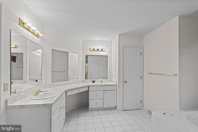 1004 Hostetter Rd, Hanover, PA 17331 - bathroom with tile patterned floors, double vanity, a garden tub, and baseboards