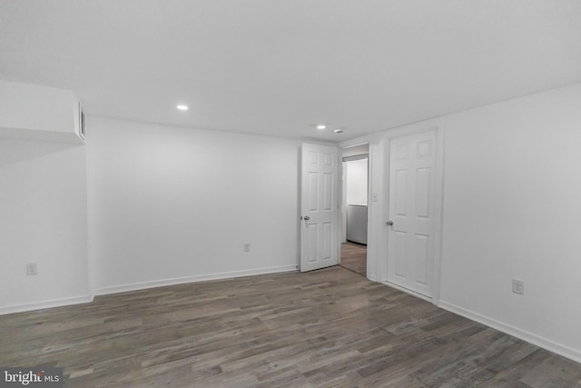 finished basement with wood finished floors, recessed lighting, and baseboards