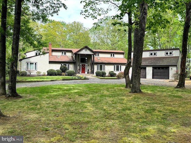 13013 Alum Springs Rd, Culpeper, VA 22701 - view of front of property with a front lawn, a garage, a chimney, and gravel driveway