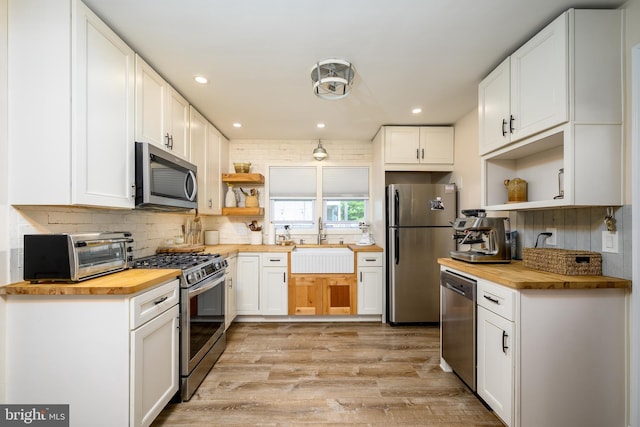 282 Eaton Ave, Hamilton, NJ 08619 - kitchen with butcher block countertops, open shelves, appliances with stainless steel finishes, a sink, and recessed lighting