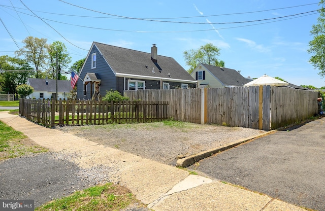 282 Eaton Ave, Hamilton, NJ 08619 - back of house featuring a chimney and a shingled roof