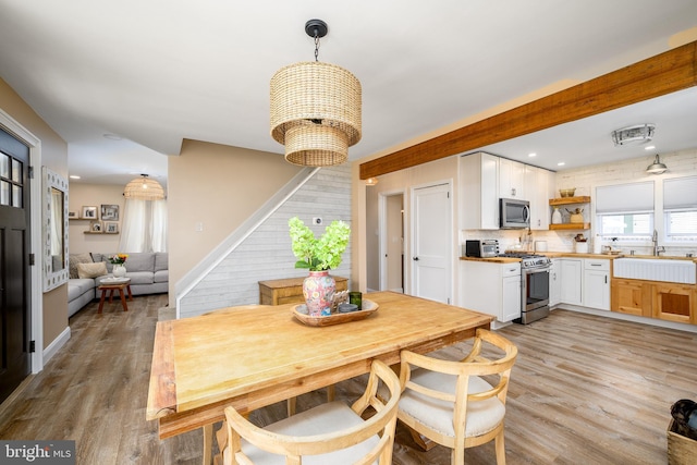 282 Eaton Ave, Hamilton, NJ 08619 - dining area with stairs, light wood-style floors, and recessed lighting