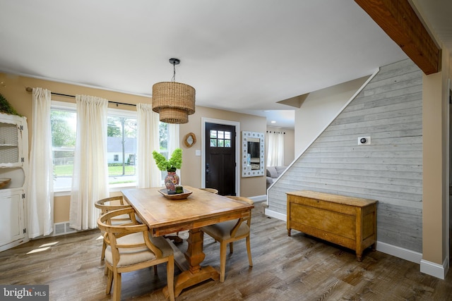 282 Eaton Ave, Hamilton, NJ 08619 - dining area with wood finished floors, wood walls, baseboards, and stairs