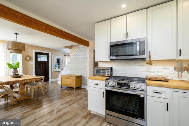 282 Eaton Ave, Hamilton, NJ 08619 - kitchen with stainless steel appliances, wooden counters, decorative backsplash, light wood finished floors, and white cabinetry