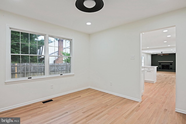 2144 Silentree Dr, Vienna, VA 22182 - empty room with light wood finished floors, ceiling fan, and recessed lighting
