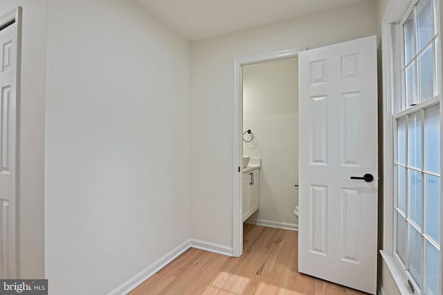 2144 Silentree Dr, Vienna, VA 22182 - unfurnished bedroom featuring light wood-style floors and baseboards