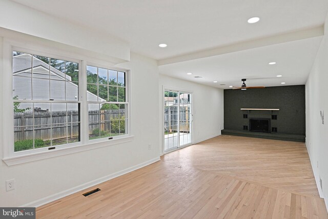 2144 Silentree Dr, Vienna, VA 22182 - unfurnished living room with a fireplace, a ceiling fan, light wood finished floors, and recessed lighting