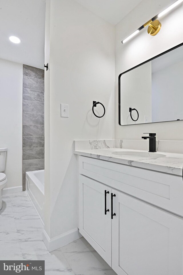 2144 Silentree Dr, Vienna, VA 22182 - full bath with marble finish floors, vanity, and recessed lighting