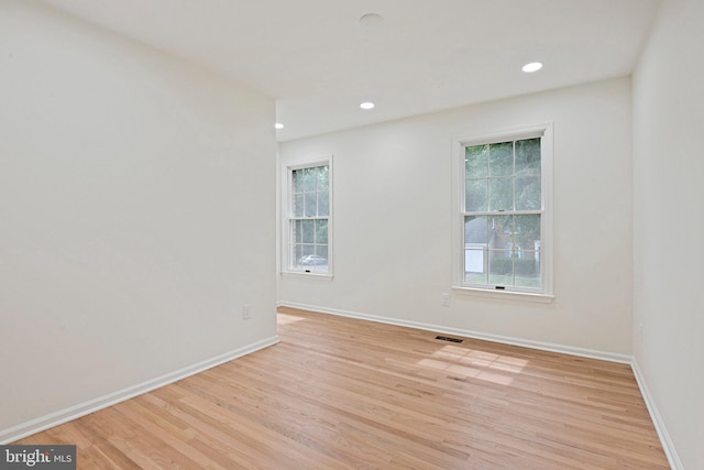 2144 Silentree Dr, Vienna, VA 22182 - empty room with light wood-style flooring and recessed lighting