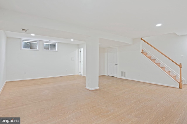 2144 Silentree Dr, Vienna, VA 22182 - basement featuring light wood-style floors, recessed lighting, and stairway