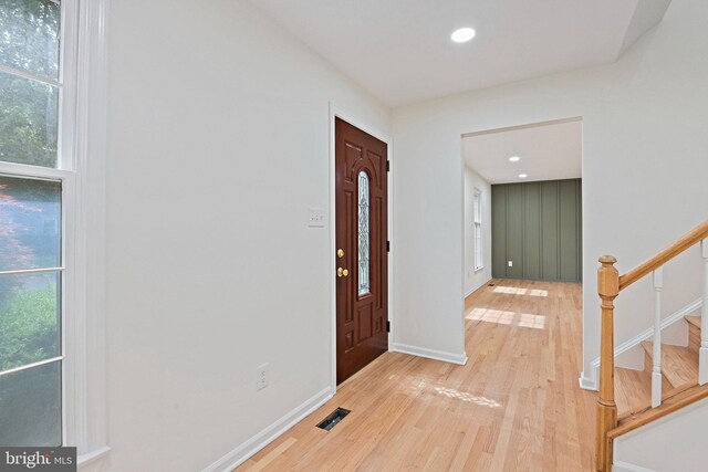 2144 Silentree Dr, Vienna, VA 22182 - foyer entrance with light wood finished floors, stairs, and recessed lighting