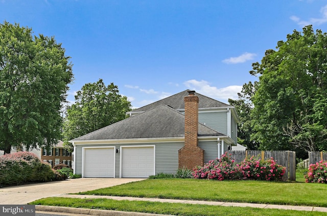 2144 Silentree Dr, Vienna, VA 22182 - view of property exterior featuring a chimney, a shingled roof, an attached garage, and driveway