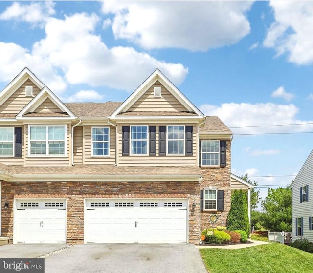 365 Pennycress Rd, Allentown, PA 18104 - view of front of property featuring asphalt driveway, a garage, stone siding, a shingled roof, and a front yard