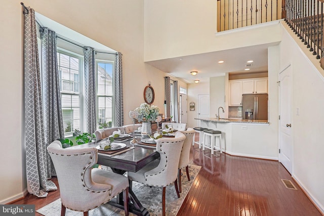 365 Pennycress Rd, Allentown, PA 18104 - dining space with dark wood-type flooring, baseboards, recessed lighting, and a towering ceiling