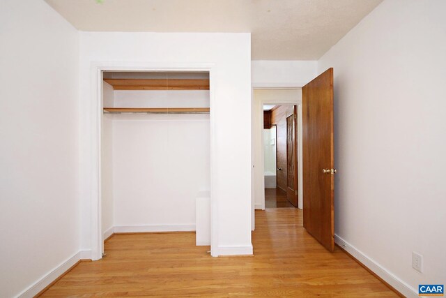 1024 Cottonwood Rd, Charlottesville, VA 22901 - unfurnished bedroom featuring light wood-style flooring, a closet, and baseboards