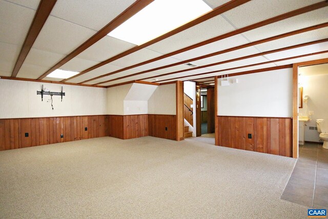 1024 Cottonwood Rd, Charlottesville, VA 22901 - carpeted spare room with a wainscoted wall, wooden walls, and stairs