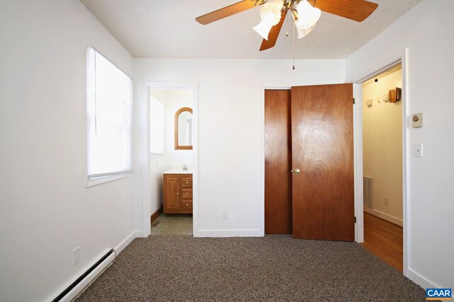 1024 Cottonwood Rd, Charlottesville, VA 22901 - unfurnished bedroom featuring a baseboard heating unit, a closet, carpet, connected bathroom, and baseboards