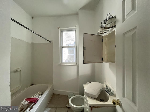 2742 W Mosher St, Baltimore, MD 21216 - full bath featuring tile patterned flooring, toilet, washtub / shower combination, baseboards, and a sink