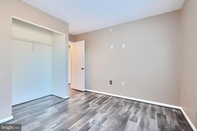 1210 Mist Wood Ct Unit 302, Belcamp, MD 21017 - unfurnished bedroom with wood finished floors, baseboards, and a closet