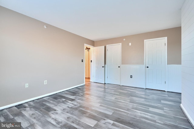 1210 Mist Wood Ct Unit 302, Belcamp, MD 21017 - unfurnished bedroom featuring wood finished floors