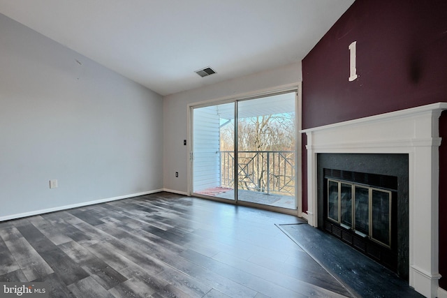 1210 Mist Wood Ct Unit 302, Belcamp, MD 21017 - unfurnished living room featuring wood finished floors, a fireplace with flush hearth, and baseboards