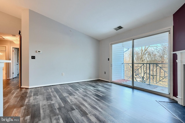 1210 Mist Wood Ct Unit 302, Belcamp, MD 21017 - unfurnished room with lofted ceiling, dark wood-style flooring, a fireplace, and baseboards