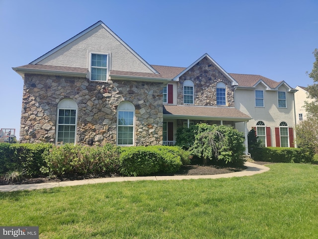 114 Saint Augustine Ct, Middletown, DE 19709 - view of front facade with a front yard and stone siding