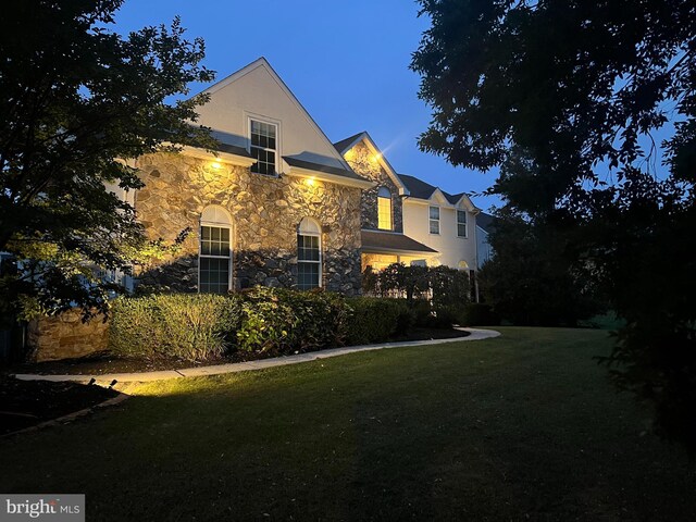 114 Saint Augustine Ct, Middletown, DE 19709 - view of home's exterior featuring stone siding, a lawn, and stucco siding