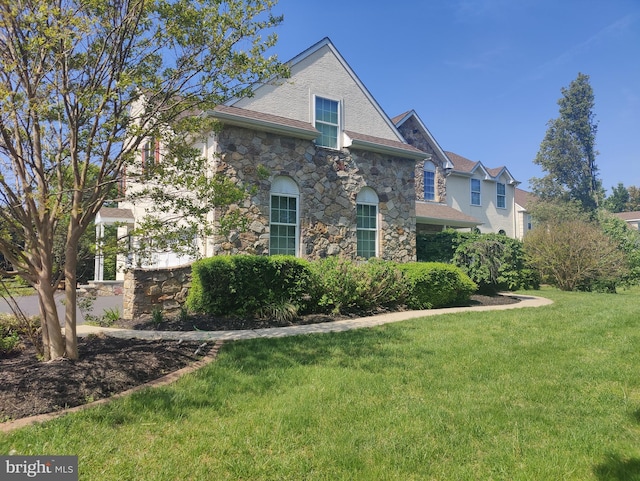 114 Saint Augustine Ct, Middletown, DE 19709 - view of home's exterior featuring stone siding and a yard