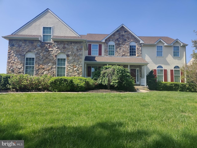 114 Saint Augustine Ct, Middletown, DE 19709 - view of front of house with a front yard and stone siding
