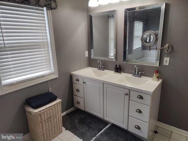 114 Saint Augustine Ct, Middletown, DE 19709 - bathroom featuring double vanity, tile patterned floors, and baseboards