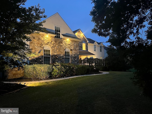 114 Saint Augustine Ct, Middletown, DE 19709 - view of home's exterior featuring stone siding, a lawn, and stucco siding