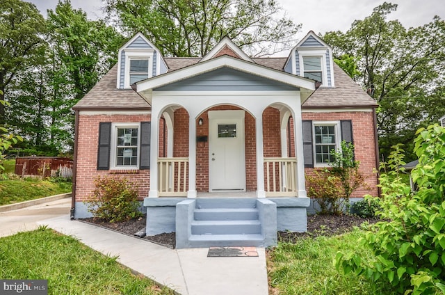4915 78th Ave, Hyattsville, MD 20784 - view of front facade featuring brick siding and roof with shingles
