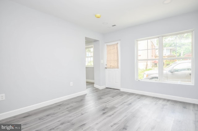 4915 78th Ave, Hyattsville, MD 20784 - empty room with wood finished floors, baseboards, and a smoke detector