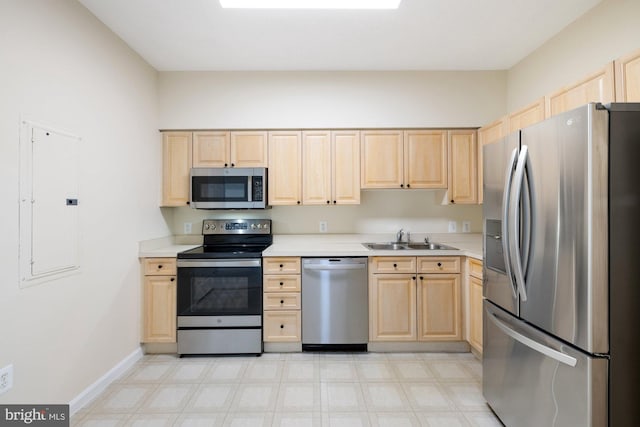 19355 Cypress Ridge Ter Unit 414, Leesburg, VA 20176 - kitchen featuring stainless steel appliances, light brown cabinets, a sink, and light countertops