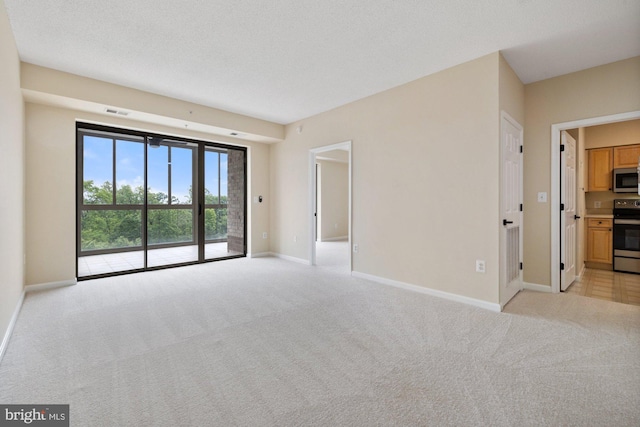 19355 Cypress Ridge Ter Unit 414, Leesburg, VA 20176 - empty room with light colored carpet and baseboards
