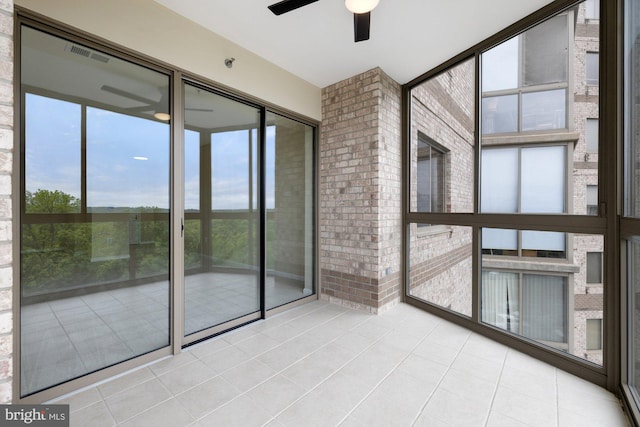 19355 Cypress Ridge Ter Unit 414, Leesburg, VA 20176 - unfurnished sunroom featuring ceiling fan and healthy amount of natural light