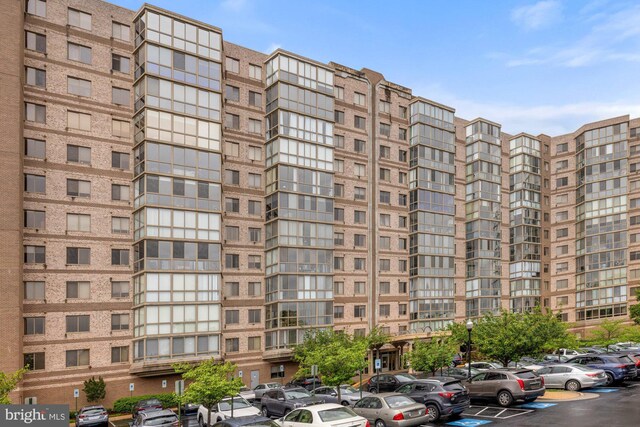 19355 Cypress Ridge Ter Unit 414, Leesburg, VA 20176 - view of apartment building / complex with uncovered parking