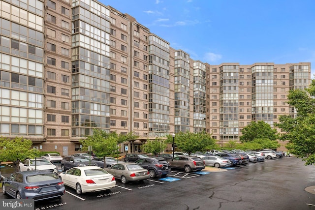 19355 Cypress Ridge Ter Unit 414, Leesburg, VA 20176 - view of apartment building / complex with uncovered parking
