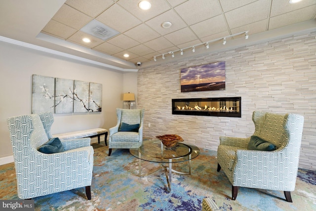 19355 Cypress Ridge Ter Unit 414, Leesburg, VA 20176 - sitting room with rail lighting, a glass covered fireplace, recessed lighting, and a paneled ceiling